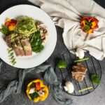 “마음챙김 식사”로 건강한 하루 열기… 소소하지만 확실한 변화 만들기 a white plate topped with meat and veggies