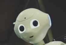 일상 속 AI 건강 관리, 똑똑하게 챙기는 법 white robot toy holding black tablet